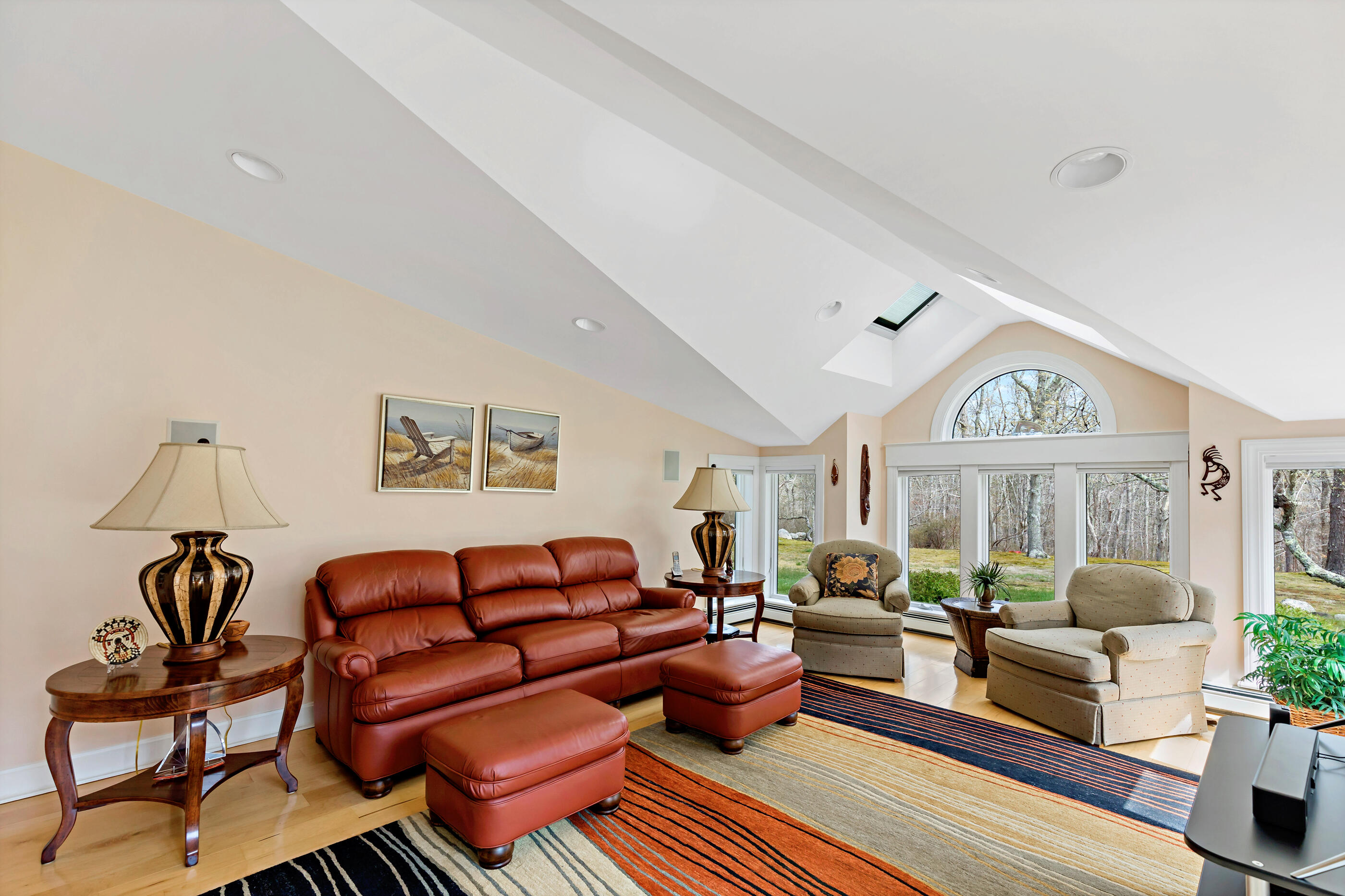 5 Shepherds Quay Brewster, MA 02631 - Photo 33 of 67 a living room with furniture a fireplace and a potted plant