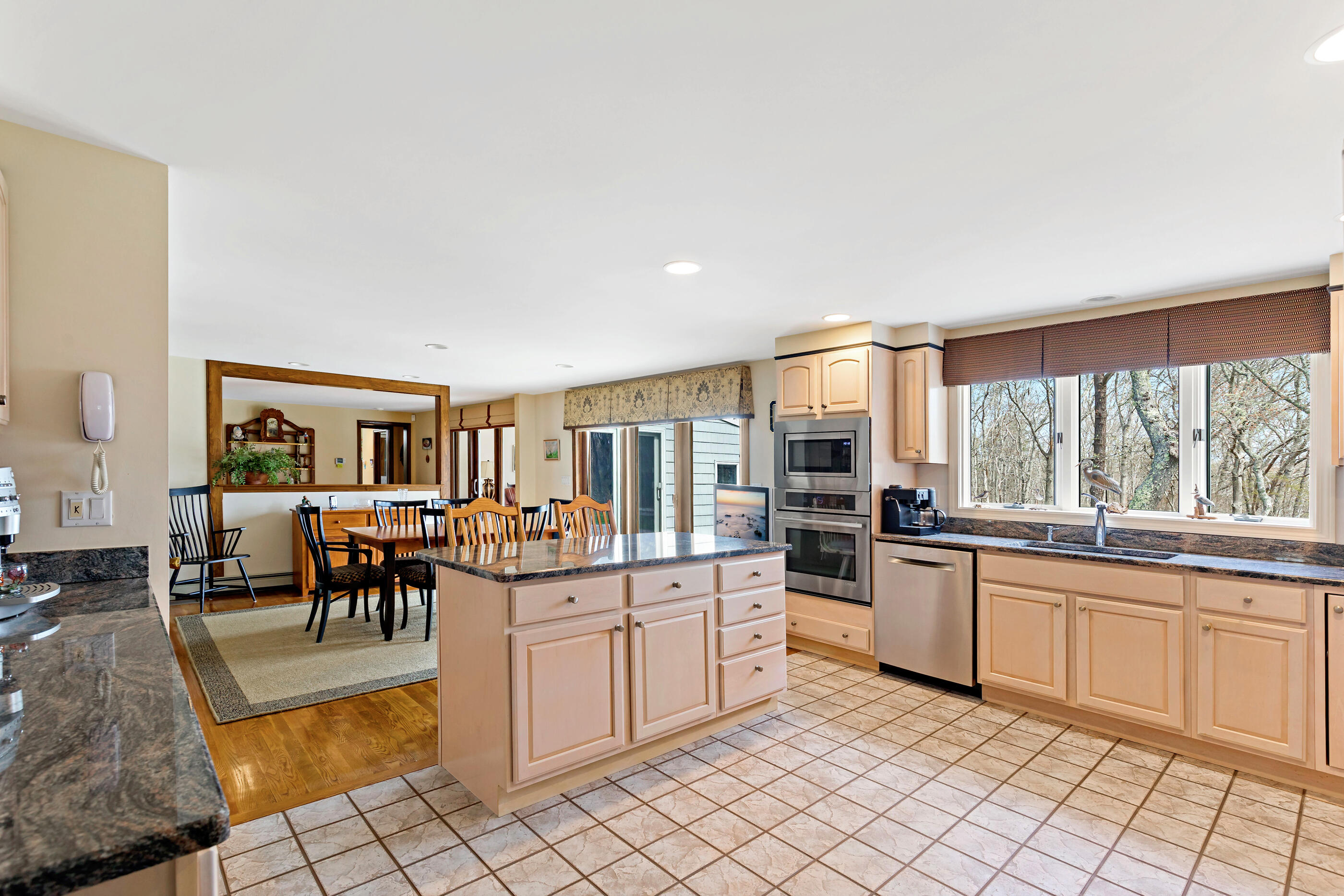 5 Shepherds Quay Brewster, MA 02631 - Photo 39 of 67 a kitchen with stainless steel appliances kitchen island granite countertop a sink and cabinets