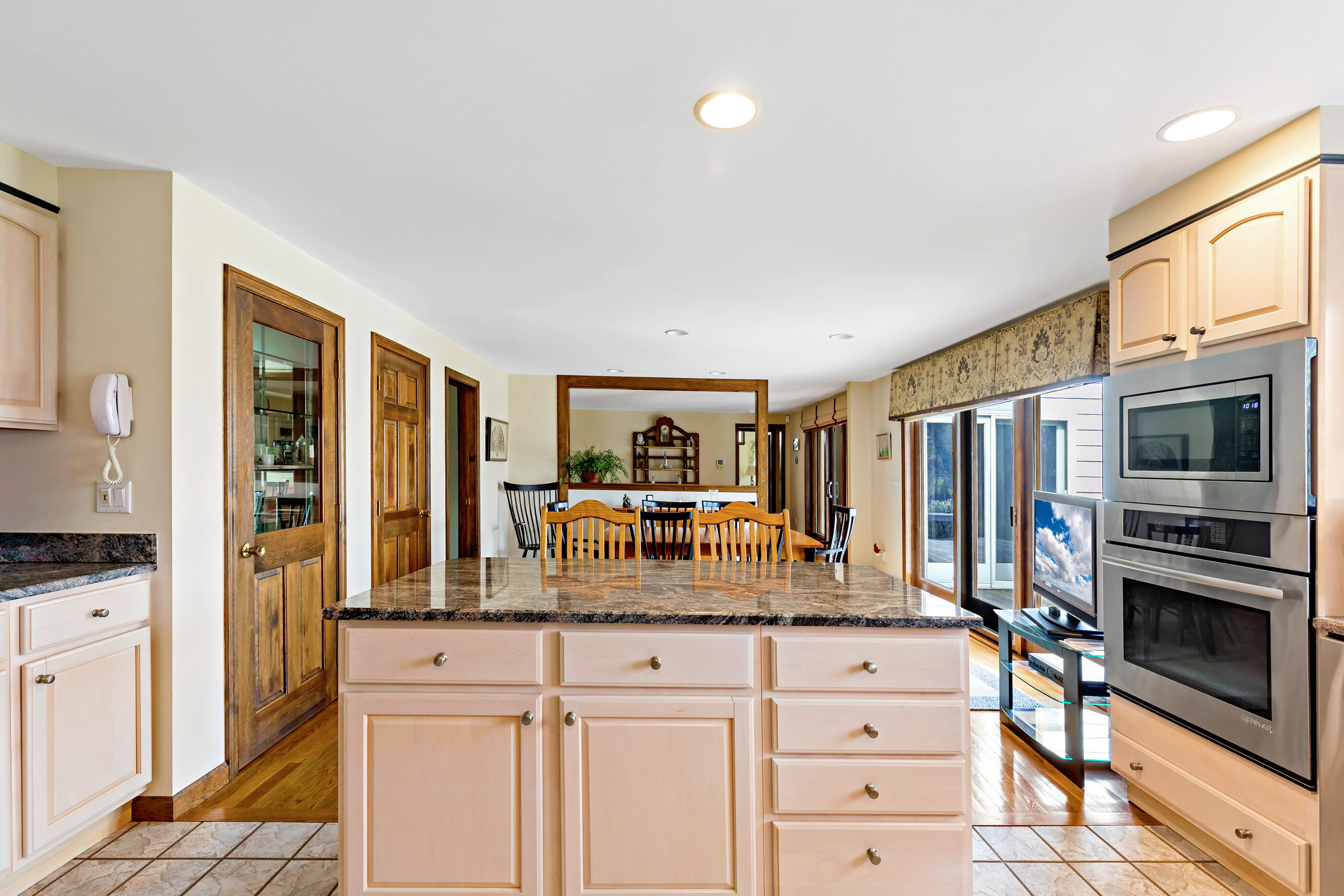 5 Shepherds Quay Brewster, MA 02631 - Photo 40 of 67 a kitchen with stainless steel appliances granite countertop a stove and cabinets