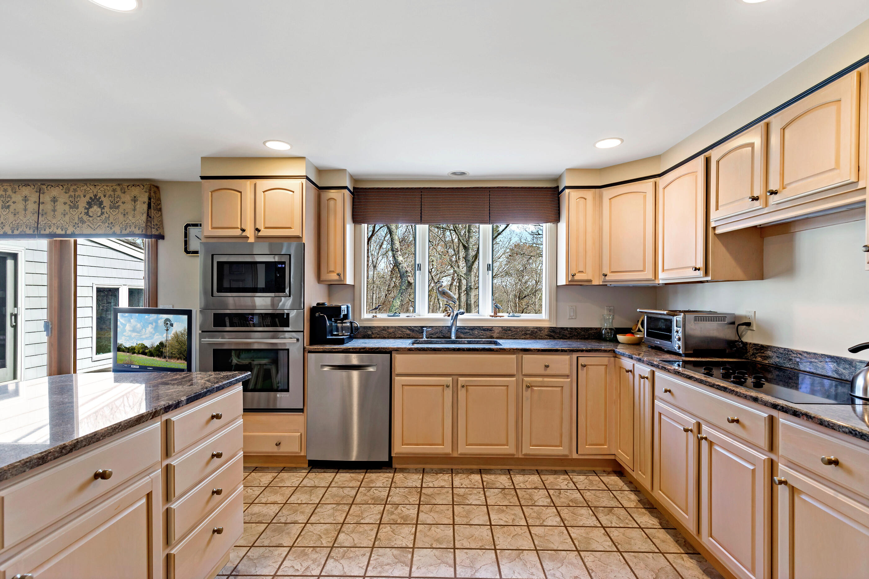 5 Shepherds Quay Brewster, MA 02631 - Photo 41 of 67 a kitchen with stainless steel appliances granite countertop a stove a sink and a microwave