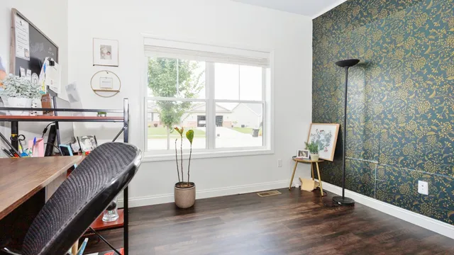 a bathroom with a toilet sink vanity and mirror