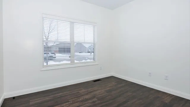 a white toilet sitting next to a bath tub