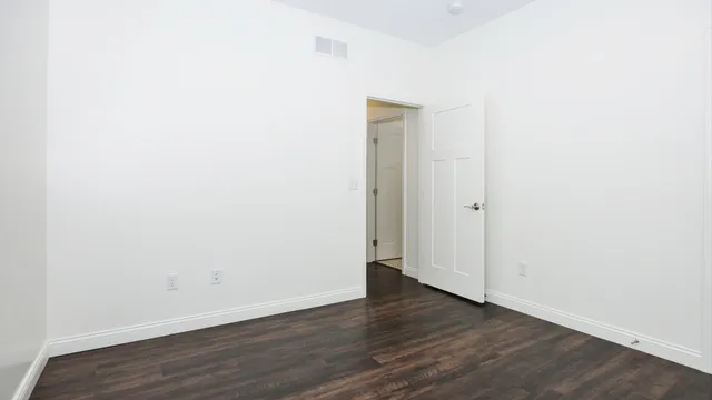 a view of a room with wooden walls