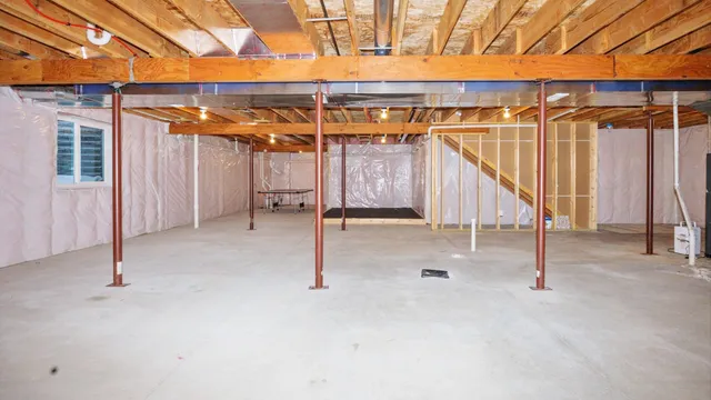 a view of a yard in front of a house with large trees