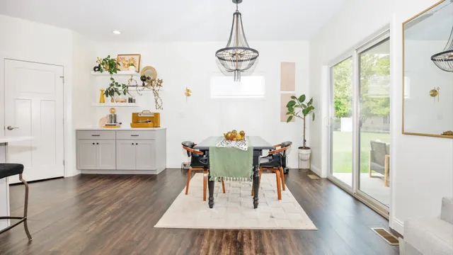 a view of a dining room with furniture and wooden floor