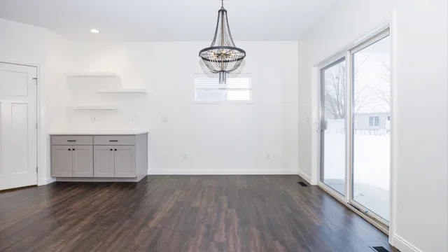 a kitchen with kitchen island a stove a sink and a refrigerator