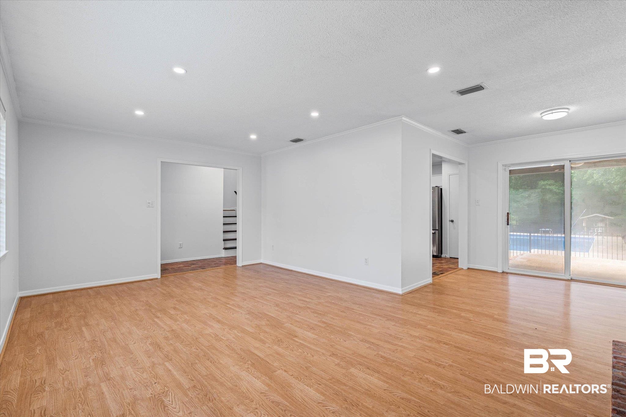 8301 Fordham Road Mobile, AL 36619 - Photo 5 of 57 Spacious interior featuring wood-finish flooring, recessed lighting, and white baseboards