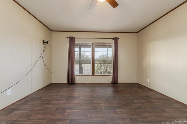 a view of an empty room with a window