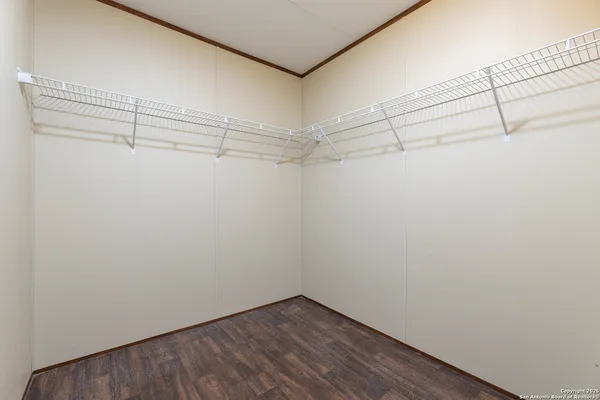 a view of a room with racks on the wall