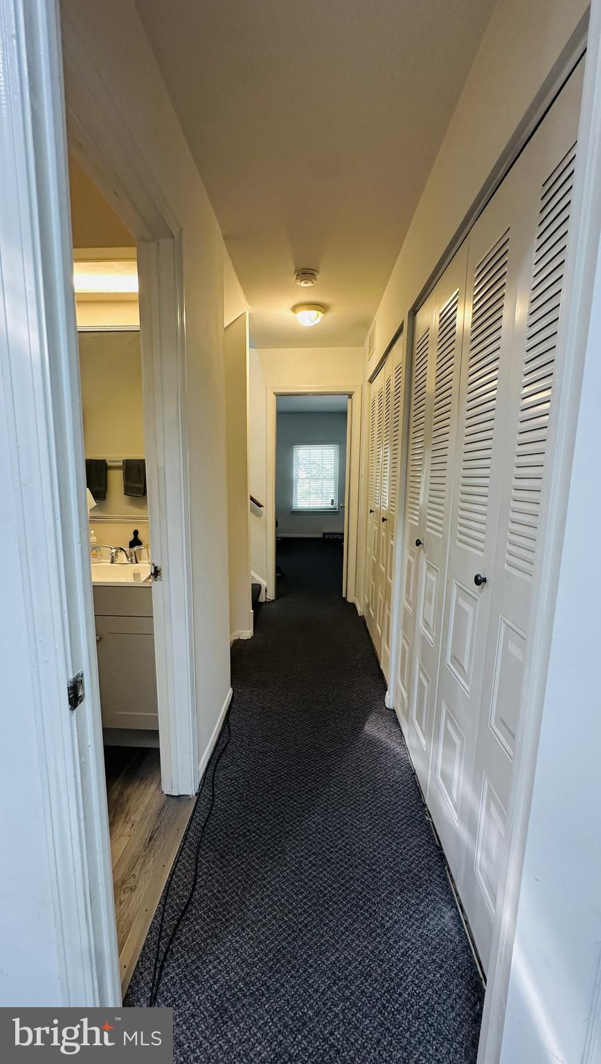 28 North Wolfe Street Baltimore, MD 21231 - Photo 24 of 25 a view of a hallway with a dining table & chairs