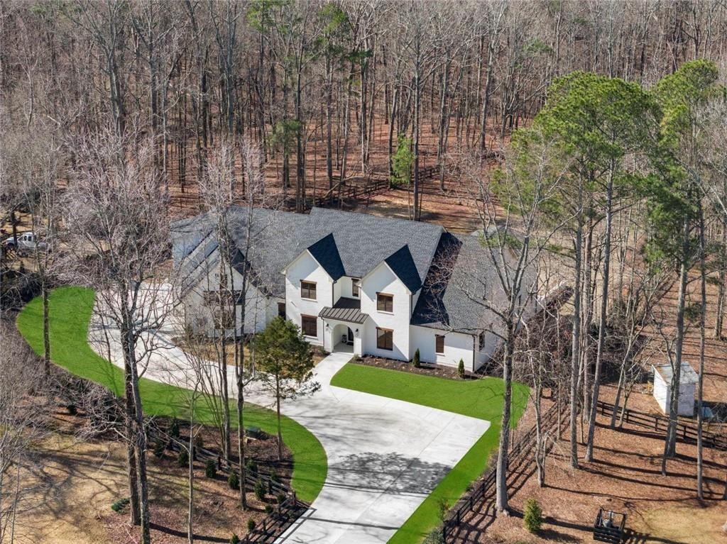 2309 Dinsmore Road Milton, GA 30004 - Photo 5 of 87 a front view of a house with a garden