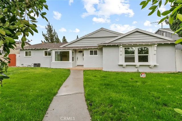 front view of a house and a yard