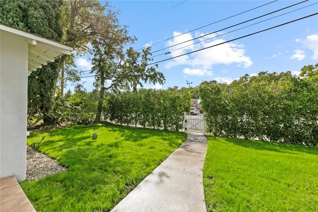 a view of a pathway with a yard