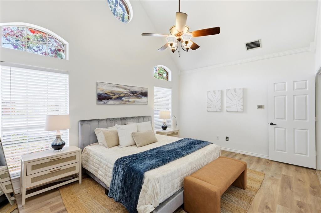 4350 Timberglen Road Dallas, TX 75287 - Photo 14 of 33 Bedroom with light wood-style flooring, lofted ceiling, and a ceiling fan