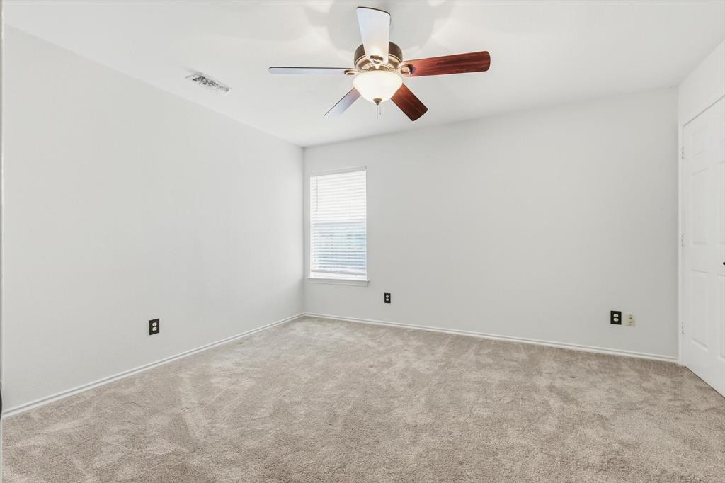 4350 Timberglen Road Dallas, TX 75287 - Photo 17 of 33 Unfurnished room featuring carpet flooring and a ceiling fan