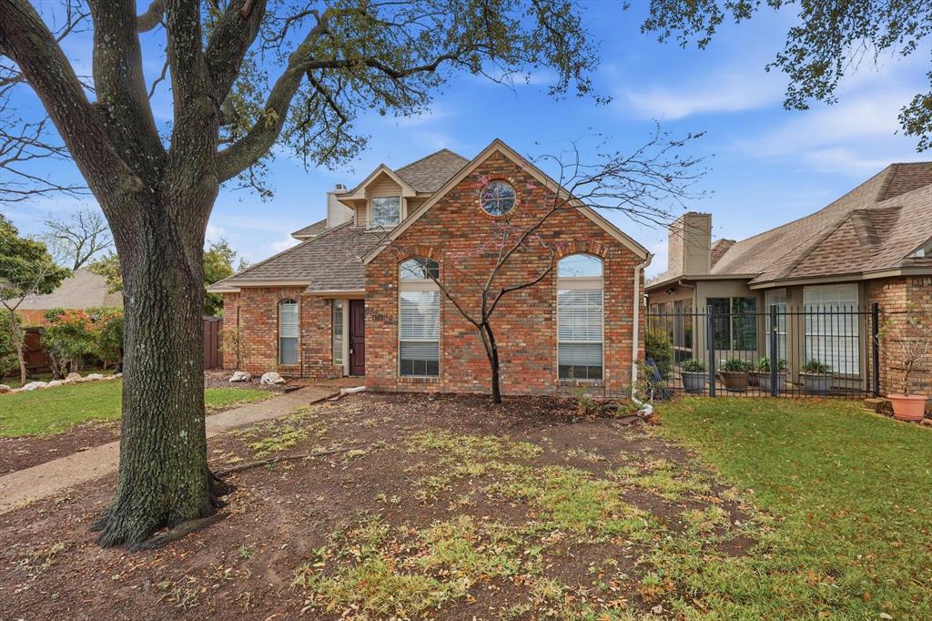 4350 Timberglen Road Dallas, TX 75287 - Photo 2 of 33 Traditional home featuring brick siding, a chimney, and roof with shingles