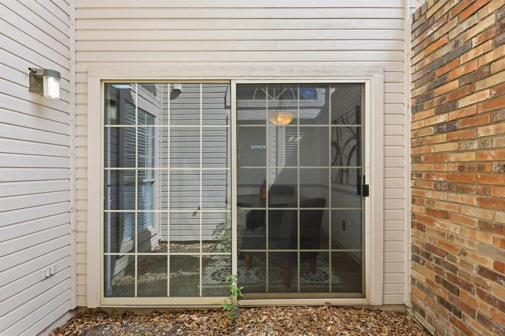 4350 Timberglen Road Dallas, TX 75287 - Photo 22 of 33 View of exterior entry featuring brick siding
