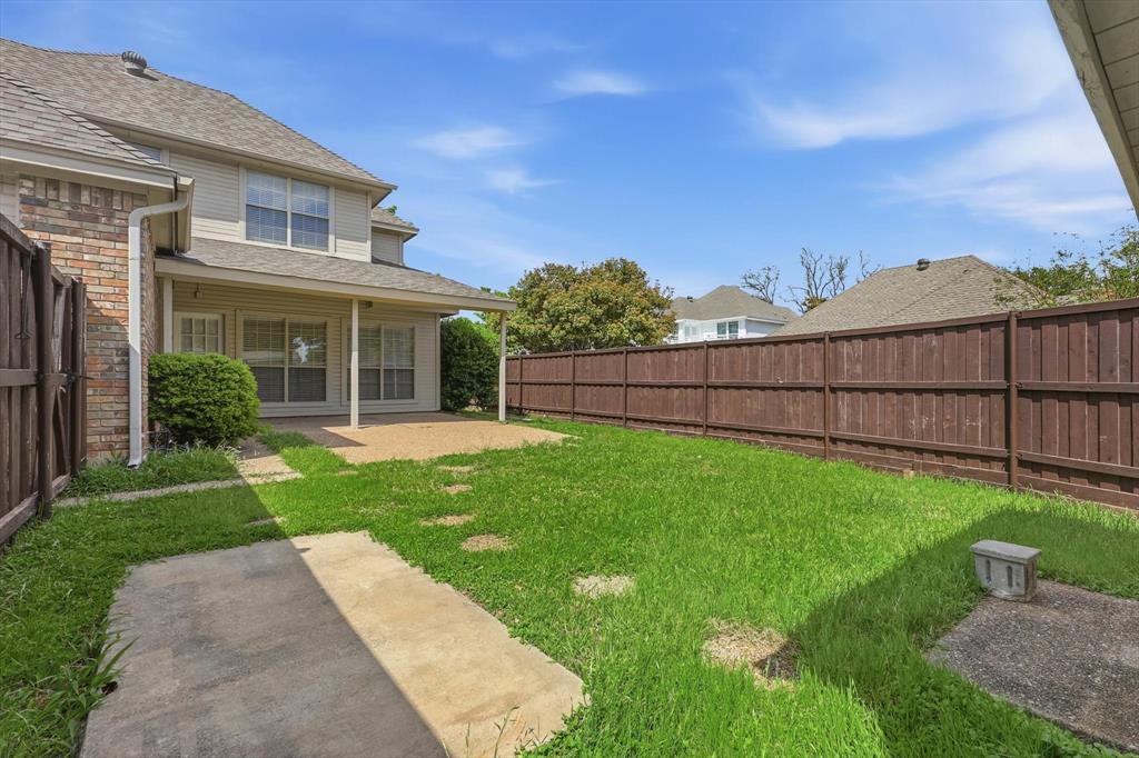 4350 Timberglen Road Dallas, TX 75287 - Photo 25 of 33 Fenced backyard with a patio area