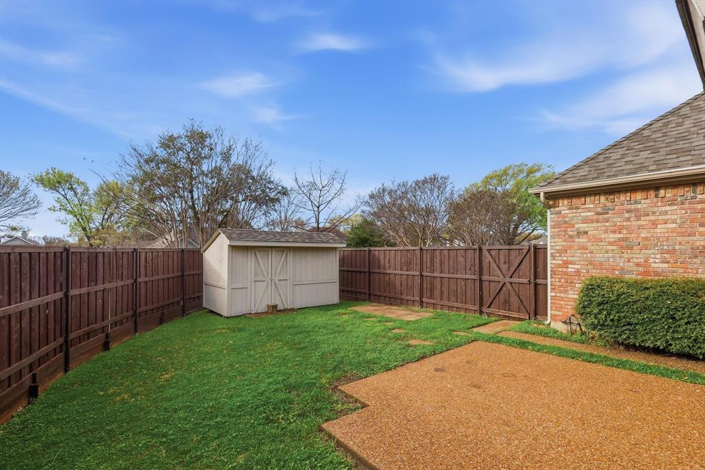 4350 Timberglen Road Dallas, TX 75287 - Photo 26 of 33 Fenced backyard with a storage shed