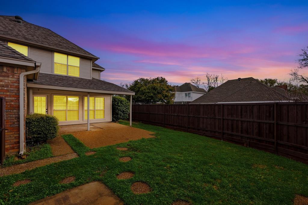 4350 Timberglen Road Dallas, TX 75287 - Photo 28 of 33 Yard at dusk featuring a patio area and a fenced backyard