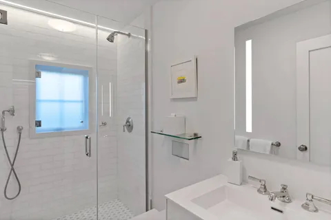 a bathroom with a sink and shower
