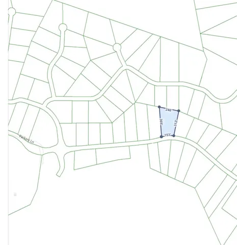 a backyard of a building with large trees