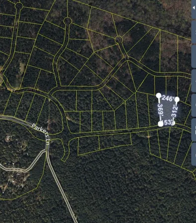 a backyard of a house with lots of trees