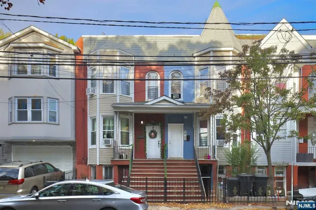 a front view of a house with street