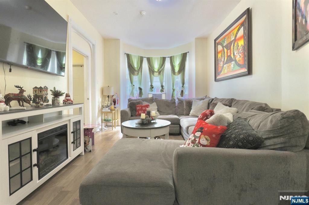 116 North 13th Street Newark, NJ 07107 - Photo 2 of 14 a living room with furniture and a fireplace