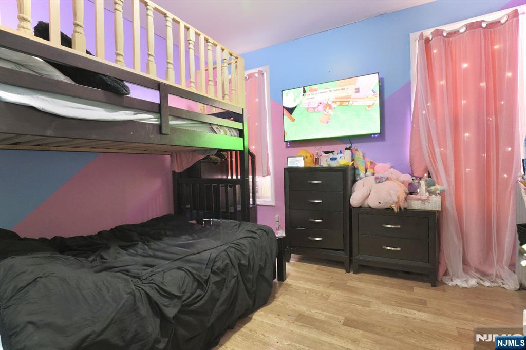 116 North 13th Street Newark, NJ 07107 - Photo 9 of 14 a bedroom with a bed and a window