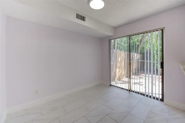 a kitchen with cabinets appliances and a sink