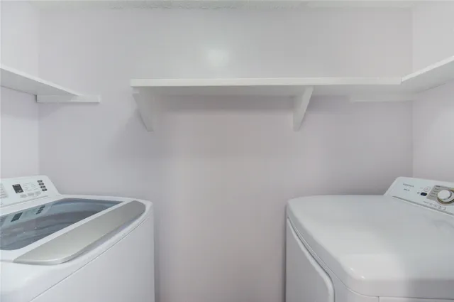 a close view of a sink a counter space and a stove in the kitchen