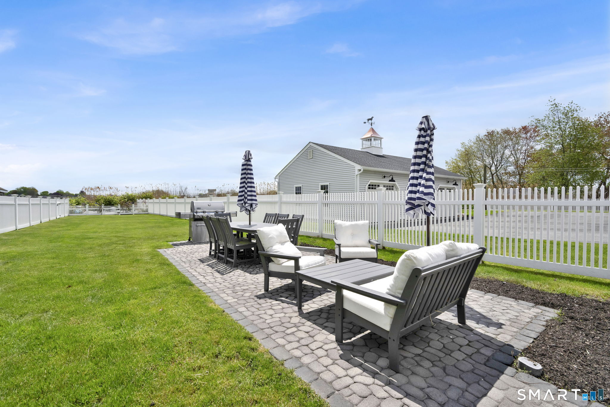 96 Chalker Beach Road Old Saybrook, CT 06475 - Photo 9 of 33 a view of a terrace with couches and sky view