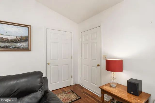 a living room with furniture and a lamp
