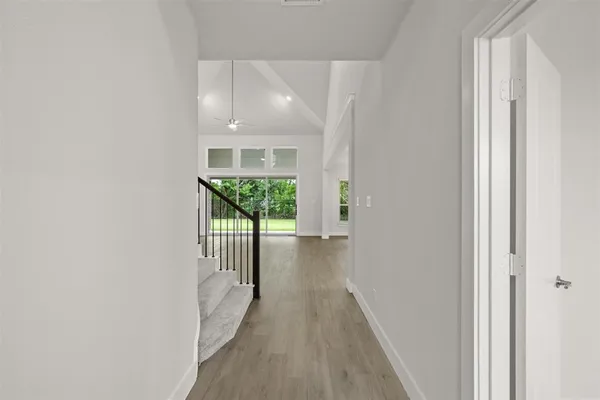 a view of a kitchen with wooden floor