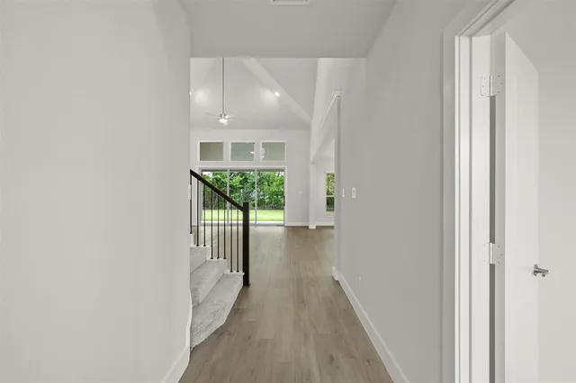 a view of a kitchen with wooden floor