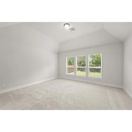 a kitchen with a stove a refrigerator and a sink