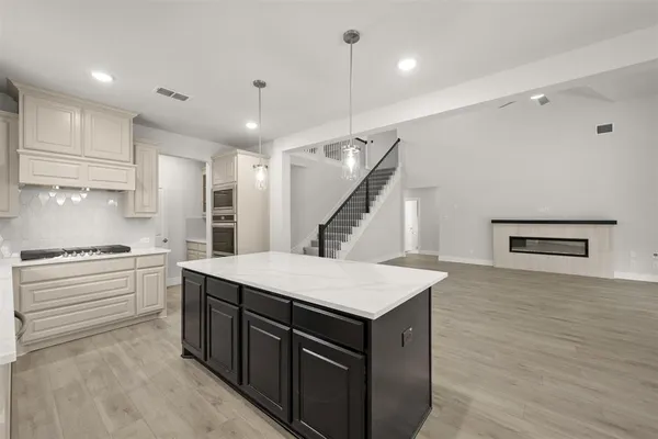 a kitchen with a sink and a refrigerator