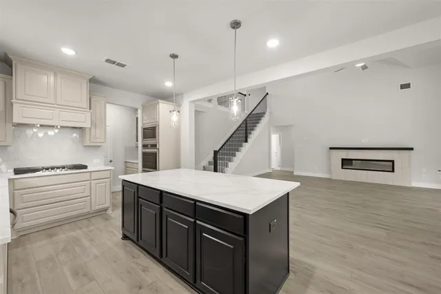a kitchen with a sink and a refrigerator