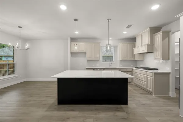 a spacious bathroom with a tub shower and mirror