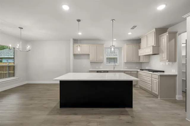 a spacious bathroom with a tub shower and mirror