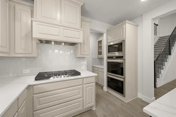 a kitchen with a sink and cabinets