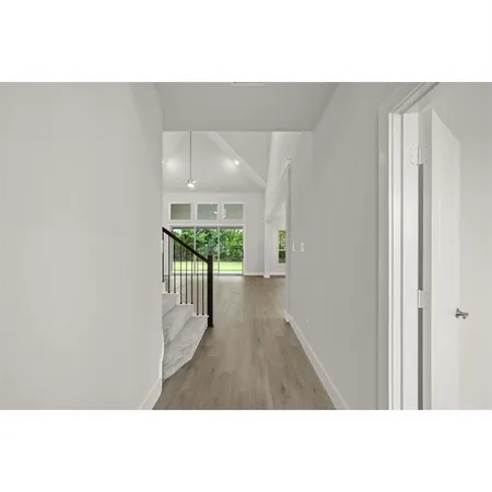 a view of an entryway with wooden floor