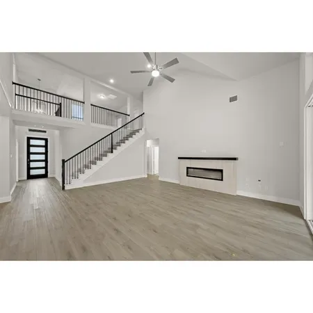 a kitchen with stainless steel appliances granite countertop a stove a sink and a white refrigerator