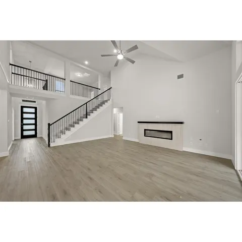 a kitchen with stainless steel appliances granite countertop a stove a sink and a white refrigerator