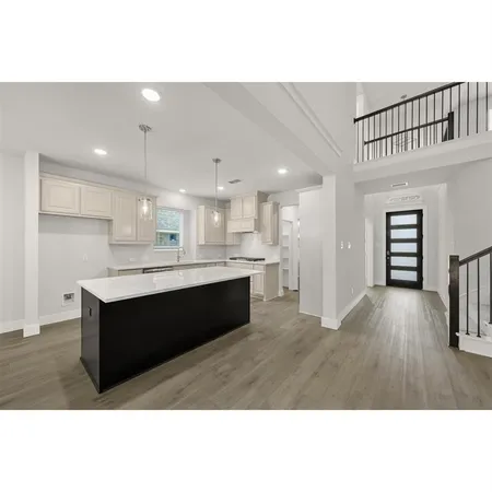 a kitchen with stainless steel appliances granite countertop a stove and a refrigerator