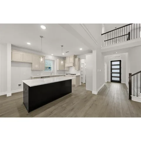 a kitchen with stainless steel appliances granite countertop a stove and a refrigerator