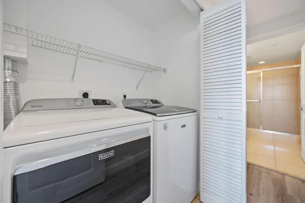 a utility room with dryer and washer