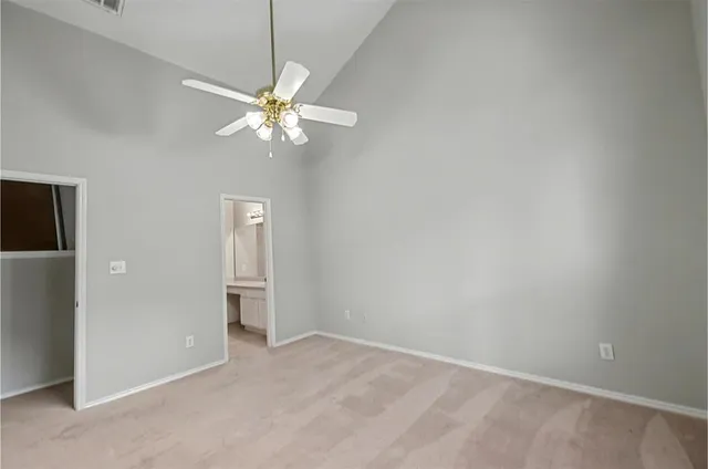 a view of a chandelier fan in a room