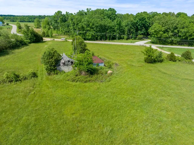 a view of a garden with a building in the background